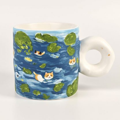 Lily Pad Latte: Hand-Painted Ceramic Mug with Donut Handle