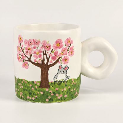 Springtime Serenity: Hand-Painted Bunny Under Blossom Tree Mug